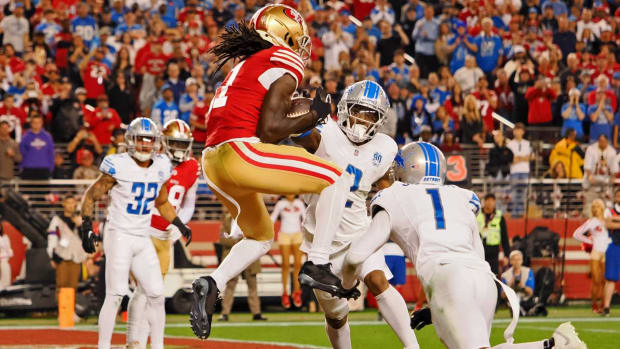 Brandon Aiyuk scores a touchdown against the Lions.